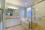 The downstairs master bath is spacious with jetted tub, shower and 2 vanity areas